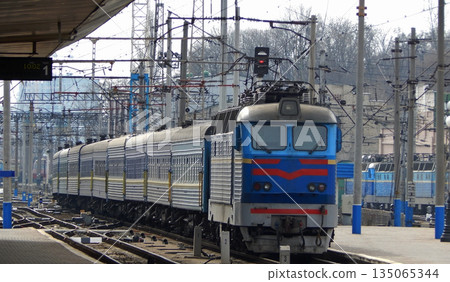 Electric Train Arrival To Platform Of Railway Station Electric Train Arrival To Platform Of Railway Station 135065344