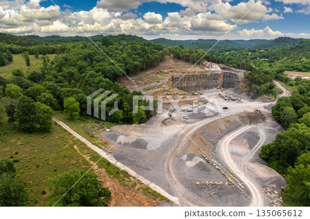 Industrial gravel quarry. Open pit mining site of limestone materials extraction for construction industry 135065612