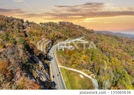 Highway road in North Carolina Appalachian mountains in fall season. Expressway lanes for fast passing of car traffic 135065636