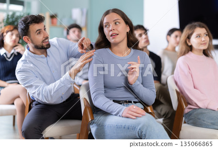 Classmates listening and talking during group discussion in class 135066865