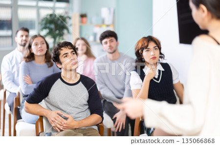 Students sit attentively in the classroom and listen to lectures Students sit attentively in the classroom and listen to lectures 135066868