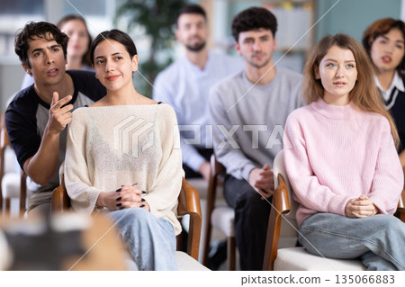 Guy student calls out to female classmate during class. Guy student calls out to female classmate during class. 135066883