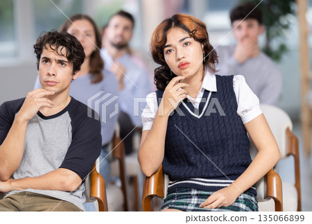 Students sit attentively in the classroom and listen to lectures 135066899