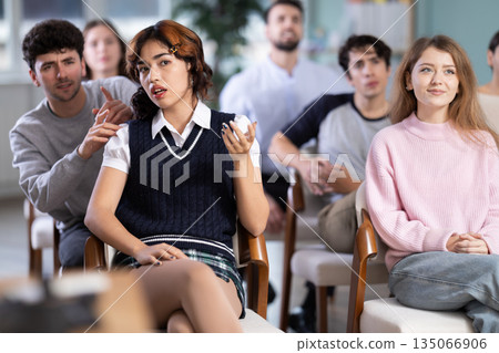 Students sit attentively in the classroom and listen to lectures 135066906