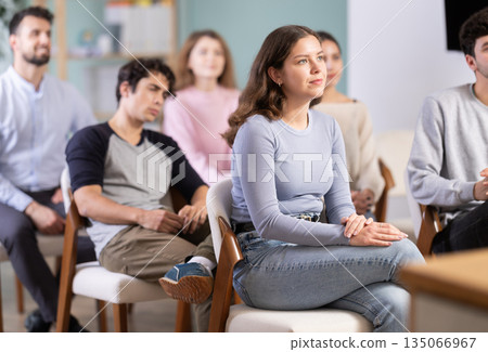 Young girl listening during seminar in a modern classroom 135066967