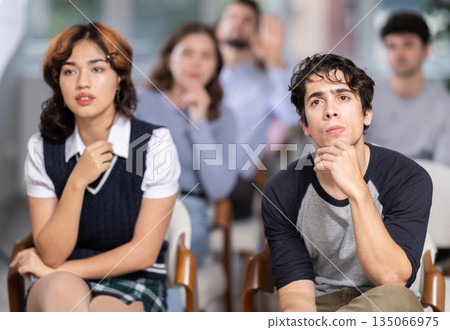Students sit attentively in the classroom and listen to lectures 135066975
