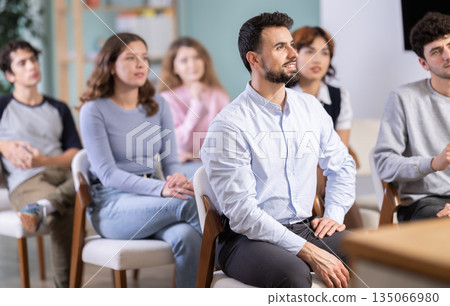 Students sit attentively in the classroom and listen to lectures 135066980