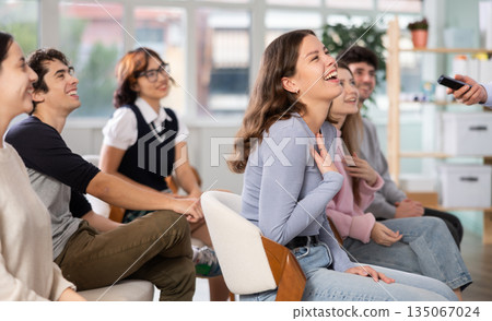 Group of happy students laughing during educational class Group of happy students laughing during educational class 135067024