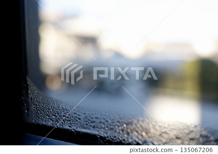 Condensation on windows during cold winter weather. 135067206
