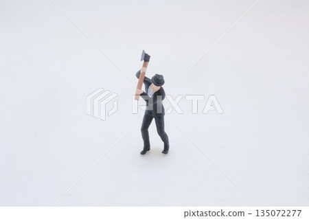 Small Figurine In Suit Swinging Axe For Dramatic Office Scene O Small Figurine In Suit Swinging Axe For Dramatic Office Scene O 135072277