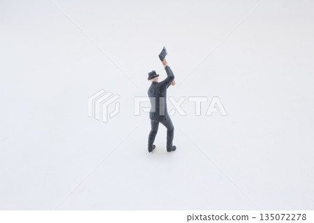 Small Figurine In Suit Swinging Axe For Dramatic Office Scene O 135072278