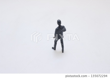 Men in dark suits forming professional security detail 135072294
