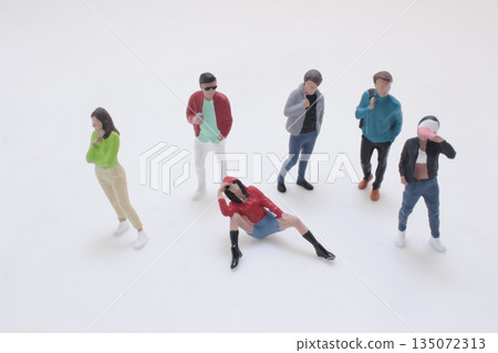 Diverse Group of Miniature People Standing Together, 135072313