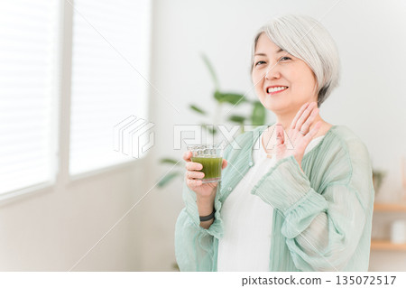 Senior women drinking green juice, green smoothies, and vegetable juice for health 135072517