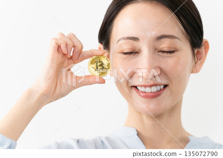 Woman holding Bitcoin Technology image Woman holding Bitcoin Technology image 135072790