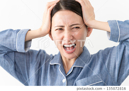 Woman wearing pajamas Lifestyle image 135072816