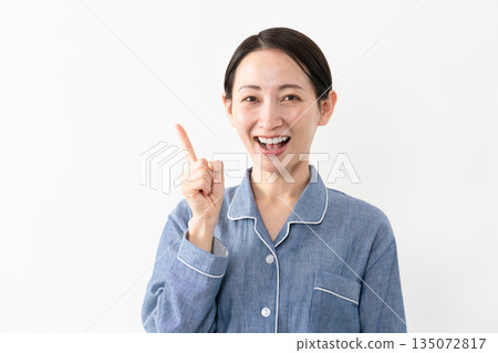 Woman wearing pajamas Lifestyle image Woman wearing pajamas Lifestyle image 135072817