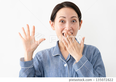 Woman wearing pajamas Lifestyle image Woman wearing pajamas Lifestyle image 135072822
