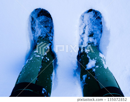 Standing on a snowy field - Winter mountain climbing and snow activities Standing on a snowy field - Winter mountain climbing and snow activities 135072852