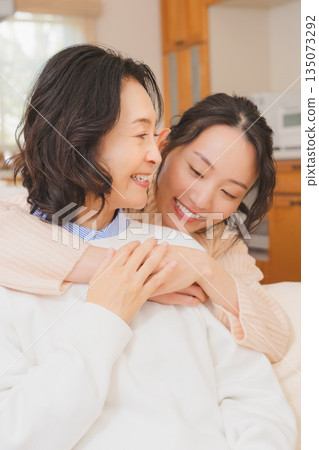 A close relationship between unmarried daughter and mother A close relationship between unmarried daughter and mother 135073292