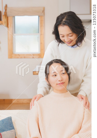 A mother comforts her daughter who is anxious about marriage A mother comforts her daughter who is anxious about marriage 135073318