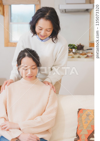 A mother comforts her daughter who is anxious about marriage A mother comforts her daughter who is anxious about marriage 135073320