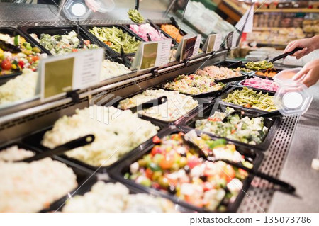 Cropped image of hands serving food 135073786