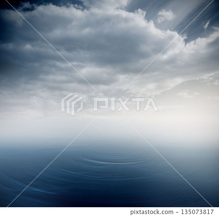 Minimalistic flat design seascape is showing calm sea water rippling under overcast cloudy sky Minimalistic flat design seascape is showing calm sea water rippling under overcast cloudy sky 135073817