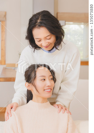 A mother comforts her daughter who is anxious about marriage A mother comforts her daughter who is anxious about marriage 135073880