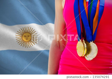 Midsection of medalist against Argentinian Flag Midsection of medalist against Argentinian Flag 135074291