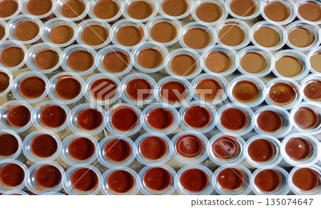Batch of Homemade Chocolate Jelly Agar-Agar Cups Traditional Asian Sweet Treat Batch of Homemade Chocolate Jelly Agar-Agar Cups Traditional Asian Sweet Treat 135074647