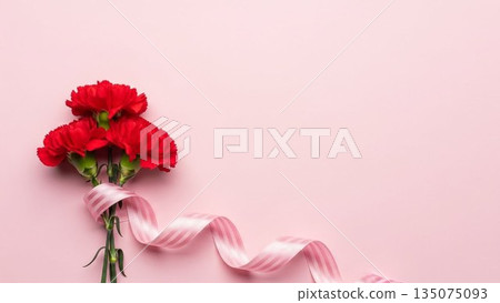 Mother's Day image of red carnations and ribbons on a pink background Mother's Day image of red carnations and ribbons on a pink background 135075093