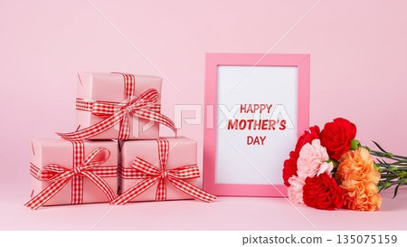 Mother's Day image of red carnations and ribbons on a pink background 135075159