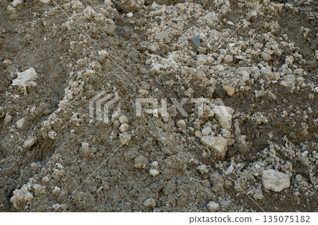 Wet construction gravel from rain 135075182
