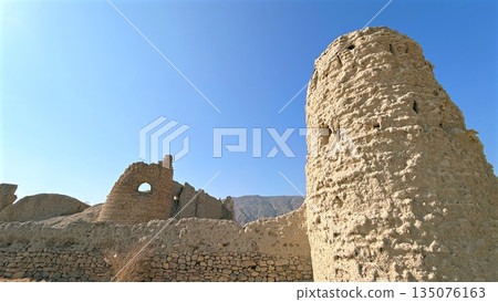 Decaying Structure Imagery, Ancient Ruins Against Bright Sky, Old Fortress Silhouette Under Clear Blue Daytime Sky, Faded Watchtower And Crumbling Walls Evoke Historic Desert Landscape Imagery Decaying Structure Imagery, Ancient Ruins Against Bright Sky, Old Fortress Silhouette Under Clear Blue Daytime Sky, Faded Watchtower And Crumbling Walls Evoke Historic Desert Landscape Imagery 135076163