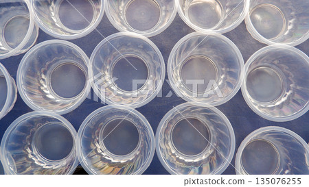 Transparent Plastic Containers Top View Pattern, Empty Disposable Bowls for Food Industry and Event Planning Transparent Plastic Containers Top View Pattern, Empty Disposable Bowls for Food Industry and Event Planning 135076255