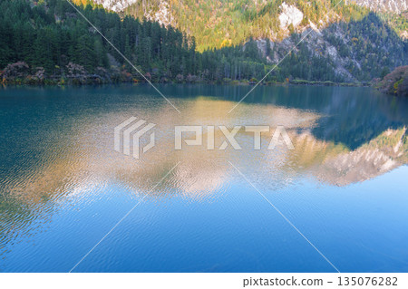Scenery Jiuzhaigou national park in Sichuan, China. Beautiful of Arrow Bamboo Lake and snow mountain in Autumn season. Famous Landmark and Vacation near Chengdu, China. Asia travel concept Scenery Jiuzhaigou national park in Sichuan, China. Beautiful of Arrow Bamboo Lake and snow mountain in Autumn season. Famous Landmark and Vacation near Chengdu, China. Asia travel concept 135076282