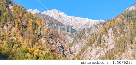 Scenery Jiuzhaigou national park in Sichuan, China. Beautiful of Arrow Bamboo Lake and snow mountain in Autumn season. Famous Landmark and Vacation near Chengdu, China. Asia travel concept Scenery Jiuzhaigou national park in Sichuan, China. Beautiful of Arrow Bamboo Lake and snow mountain in Autumn season. Famous Landmark and Vacation near Chengdu, China. Asia travel concept 135076283