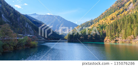 Scenery Jiuzhaigou national park in Sichuan, China. Beautiful of Arrow Bamboo Lake and snow mountain in Autumn season. Famous Landmark and Vacation near Chengdu, China. Asia travel concept Scenery Jiuzhaigou national park in Sichuan, China. Beautiful of Arrow Bamboo Lake and snow mountain in Autumn season. Famous Landmark and Vacation near Chengdu, China. Asia travel concept 135076286