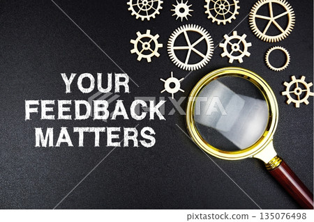 Your Feedback Matters text message with magnifying glass on black background Your Feedback Matters text message with magnifying glass on black background 135076498
