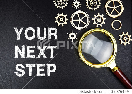 Your Next Step text message with magnifying glass on black background Your Next Step text message with magnifying glass on black background 135076499
