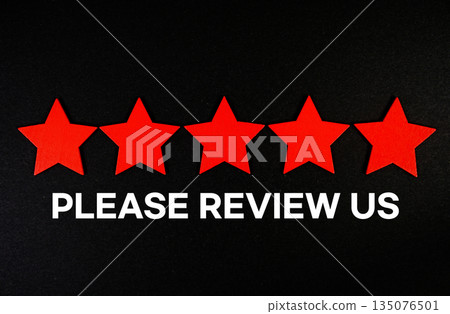 Please Review Us text with five star on black background Please Review Us text with five star on black background 135076501