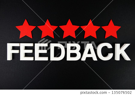 Feedback alphabet letters with fife red star on black background Feedback alphabet letters with fife red star on black background 135076502