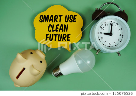 Smart Use. Clean Future with light bulb, piggy bank and alarm clock on green background 135076526