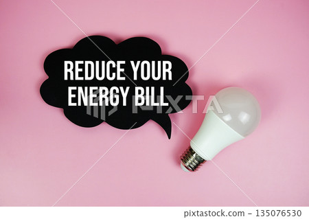 Reduce Your Energy Bill with light bulb on pink background 135076530