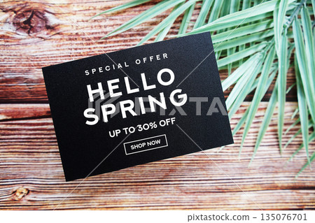 Hello Spring Sale 30% off with green leaf on wooden background Promotion Offer Discount Retail Shopping Concept 135076701