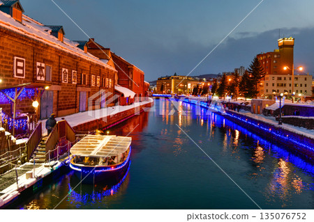 Otaru water canal and buildings along the waterfront outdoor in winter at nightime in Hokkaido , Otaru, Japan Otaru water canal and buildings along the waterfront outdoor in winter at nightime in Hokkaido , Otaru, Japan 135076752