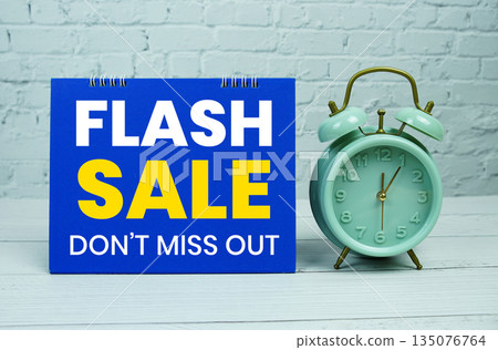 Flash Sale text Promotion and Marketing with alarm clock on wooden background Flash Sale text Promotion and Marketing with alarm clock on wooden background 135076764