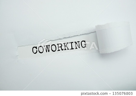 Coworking message written on white paper with torn paper background Coworking message written on white paper with torn paper background 135076803