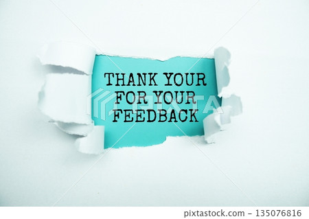 Thank you for your Feedback message written on blue paper with torn paper background 135076816